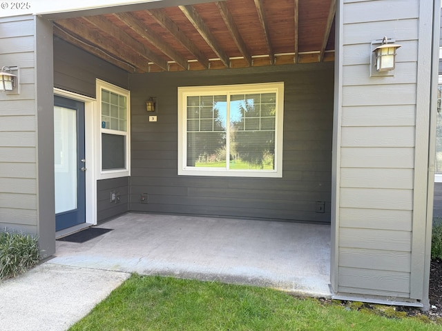 doorway to property featuring covered porch