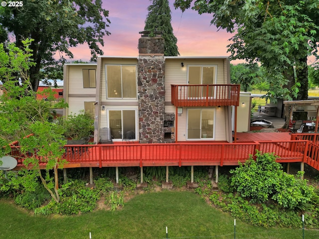 1321 66th St, Springfield, OR 97478 - back of property with a balcony, a yard, a wooden deck, and a chimney