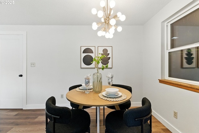 7631 SE Thompson Rd, Milwaukie, OR 97222 - dining room featuring a chandelier and wood finished floors