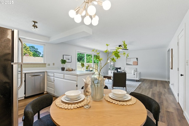 7631 SE Thompson Rd, Milwaukie, OR 97222 - dining room with a chandelier and wood finished floors