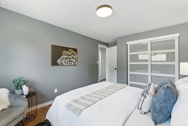 7631 SE Thompson Rd, Milwaukie, OR 97222 - bedroom featuring wood finished floors and baseboards