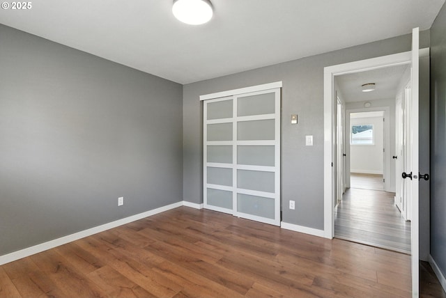 7631 SE Thompson Rd, Milwaukie, OR 97222 - unfurnished bedroom with dark wood-style floors and a closet