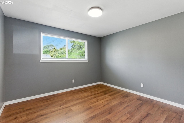 7631 SE Thompson Rd, Milwaukie, OR 97222 - empty room featuring wood finished floors and baseboards