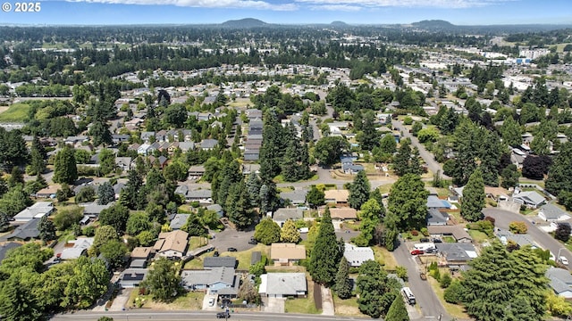 7631 SE Thompson Rd, Milwaukie, OR 97222 - aerial view of property's location featuring nearby suburban area and a mountainous background