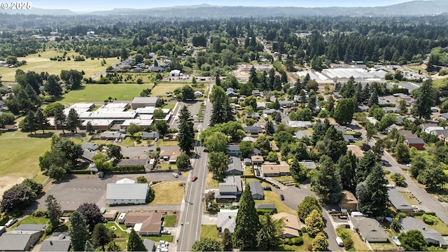7631 SE Thompson Rd, Milwaukie, OR 97222 - aerial view of property and surrounding area with nearby suburban area and a forest
