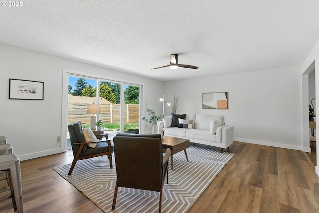 7631 SE Thompson Rd, Milwaukie, OR 97222 - living area with a ceiling fan, wood finished floors, and a textured ceiling
