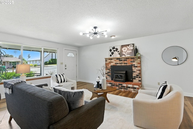 7631 SE Thompson Rd, Milwaukie, OR 97222 - living area with a chandelier, wood finished floors, and a textured ceiling
