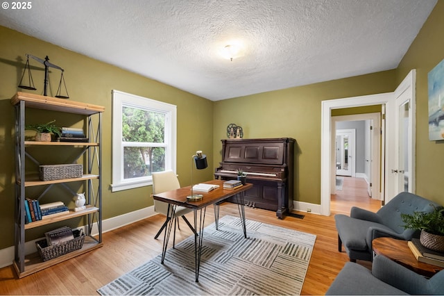 6116 SE 36th Ave, Portland, OR 97202 - office area featuring light wood-style floors, a textured ceiling, and baseboards