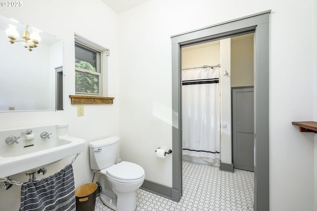 bathroom featuring toilet and sink