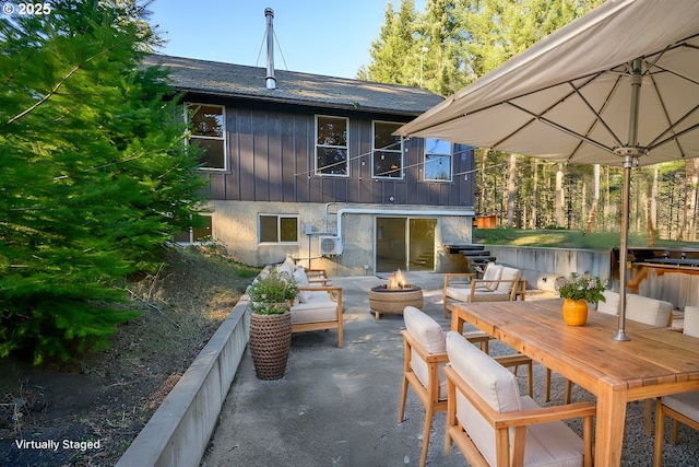 view of patio / terrace with a fire pit