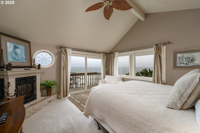 carpeted bedroom with access to outside, lofted ceiling with beams, ceiling fan, and a water view