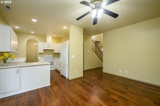 1367 Cramner St, Lafayette, OR 97127 - kitchen with white appliances, under cabinet range hood, a peninsula, dark wood finished floors, and ceiling fan
