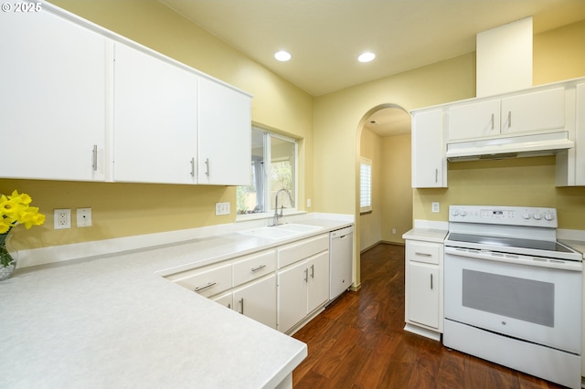 1367 Cramner St, Lafayette, OR 97127 - kitchen with white appliances, under cabinet range hood, a sink, arched walkways, and light countertops