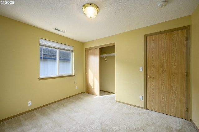 1367 Cramner St, Lafayette, OR 97127 - unfurnished bedroom with carpet flooring, a closet, baseboards, and a textured ceiling