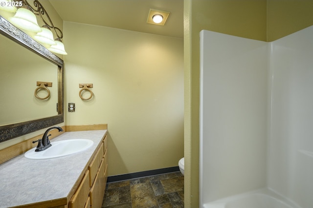 1367 Cramner St, Lafayette, OR 97127 - full bath with vanity, toilet, baseboards, stone finish flooring, and a shower