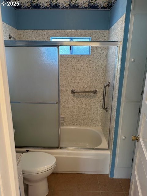 1413 Union Ave, North Bend, OR 97459 - full bathroom with tile patterned flooring, enclosed tub / shower combo, and toilet
