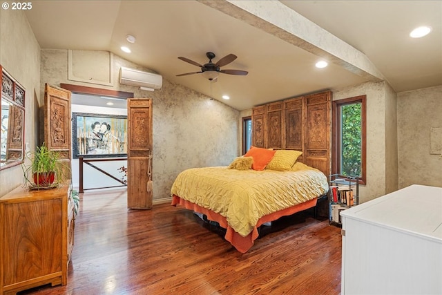 bedroom featuring wood finished floors, vaulted ceiling, a wall mounted AC, and recessed lighting