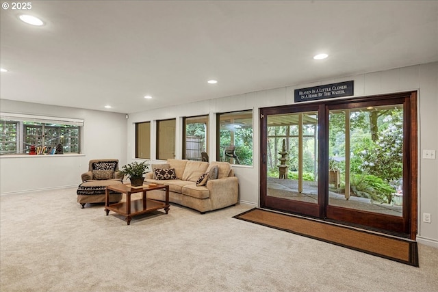 carpeted living area with recessed lighting, plenty of natural light, and baseboards