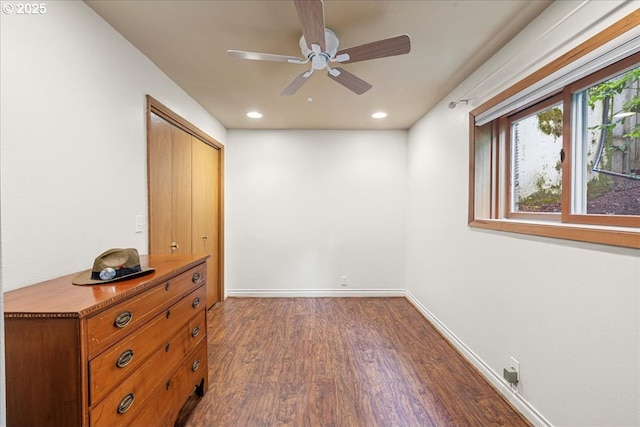 unfurnished bedroom with dark wood-type flooring, recessed lighting, baseboards, a closet, and ceiling fan