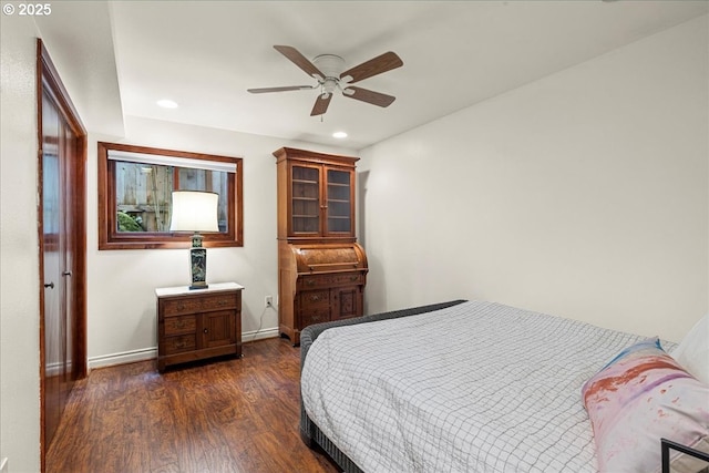 bedroom featuring baseboards, dark wood-type flooring, recessed lighting, and a ceiling fan