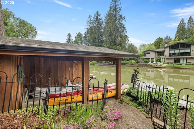 view of outbuilding with a water view
