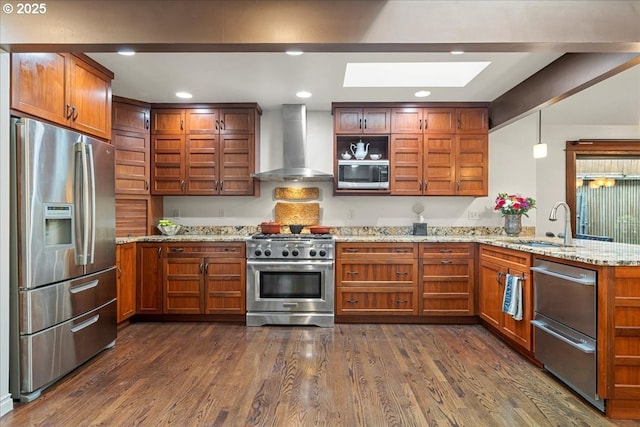 kitchen with stainless steel appliances, wall chimney exhaust hood, a peninsula, a skylight, and open shelves