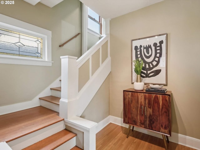 stairway featuring hardwood / wood-style floors