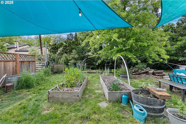 view of yard featuring a garden and fence