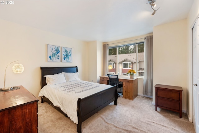 bedroom with light carpet