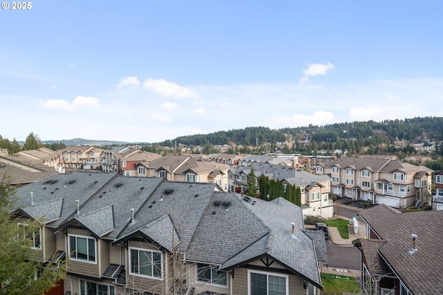 birds eye view of property with a residential view