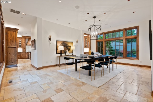 dining space with a chandelier