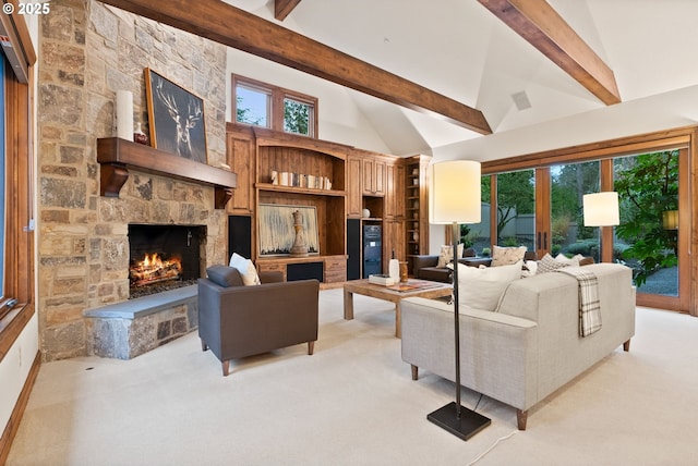 living room with beamed ceiling, light colored carpet, a fireplace, and high vaulted ceiling