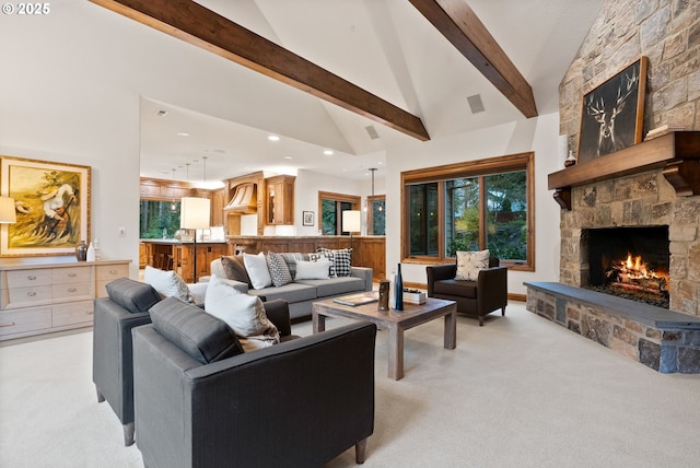 living room featuring beam ceiling, light carpet, a fireplace, and high vaulted ceiling