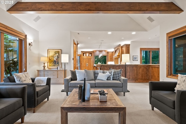 carpeted living room featuring lofted ceiling