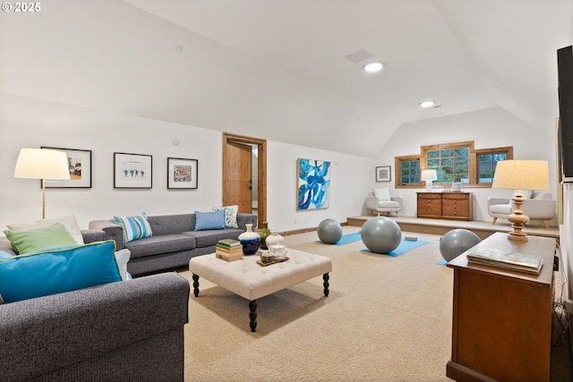 living room with light carpet and vaulted ceiling