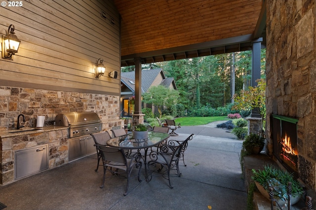 view of patio / terrace with sink, grilling area, and exterior kitchen