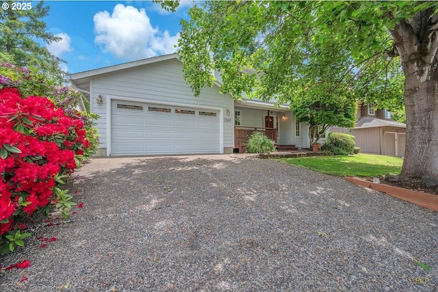 5868 NW Landing Dr, Portland, OR 97210 - ranch-style house with a garage, driveway, and a porch