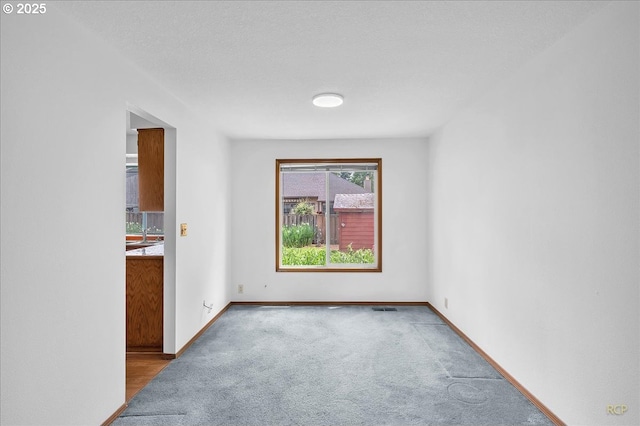 5868 NW Landing Dr, Portland, OR 97210 - carpeted empty room featuring baseboards