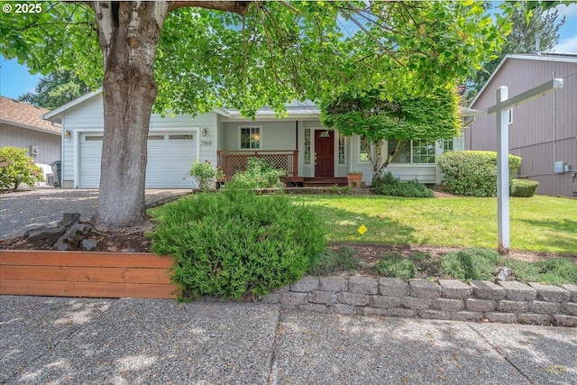 5868 NW Landing Dr, Portland, OR 97210 - view of front of house with a porch, a garage, a front yard, and asphalt driveway