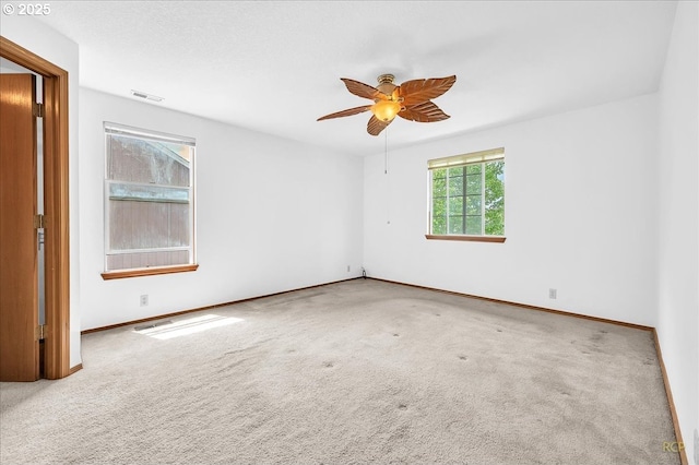 5868 NW Landing Dr, Portland, OR 97210 - carpeted spare room with baseboards and ceiling fan