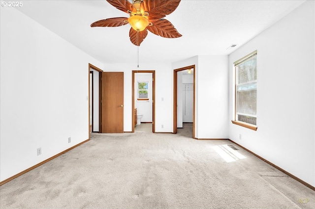 5868 NW Landing Dr, Portland, OR 97210 - unfurnished bedroom with multiple windows, carpet floors, and baseboards