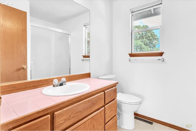 5868 NW Landing Dr, Portland, OR 97210 - bathroom featuring plenty of natural light, toilet, vanity, and a shower stall