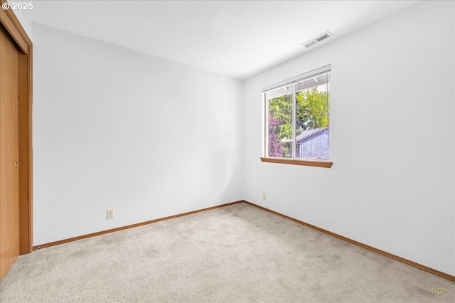 5868 NW Landing Dr, Portland, OR 97210 - unfurnished bedroom featuring carpet flooring, a closet, and baseboards