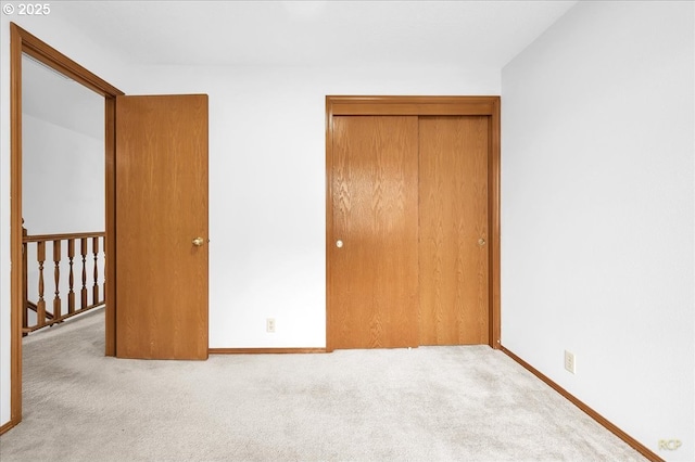 5868 NW Landing Dr, Portland, OR 97210 - unfurnished bedroom featuring carpet, a closet, and baseboards