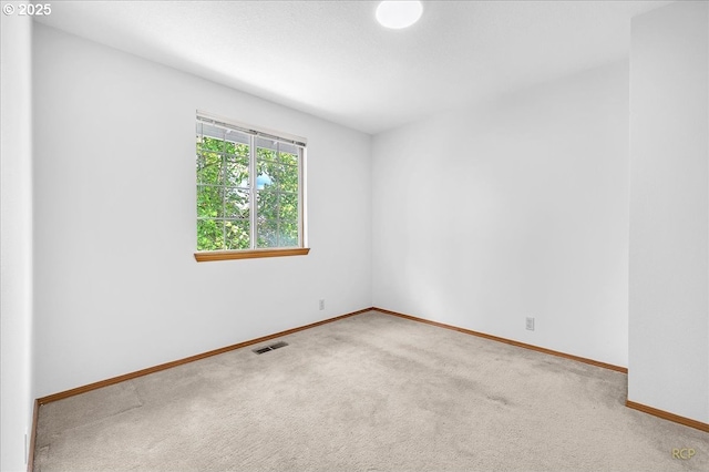 5868 NW Landing Dr, Portland, OR 97210 - spare room with carpet flooring and baseboards