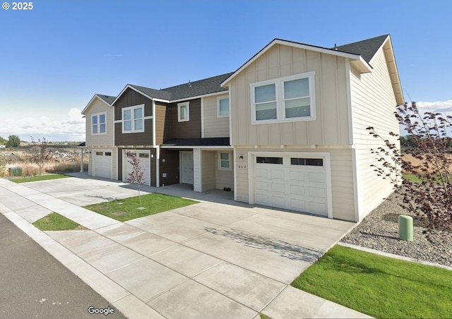804 E Oregon Ave, Hermiston, OR 97838 - view of front of property with an attached garage, concrete driveway, and board and batten siding