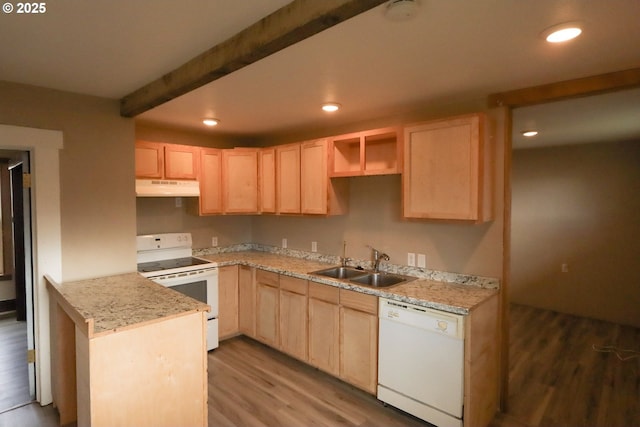 kitchen featuring light brown cabinets, white appliances, under cabinet range hood, and a sink