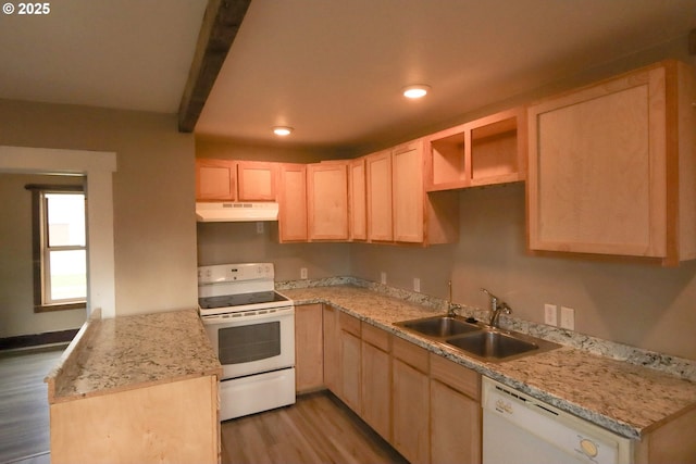 kitchen with white appliances, light wood-style flooring, a sink, light brown cabinetry, and under cabinet range hood