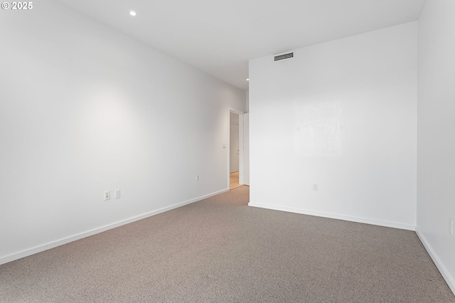 1150 NW Quimby St Unit 608, Portland, OR 97209 - unfurnished room with carpet flooring, recessed lighting, and baseboards