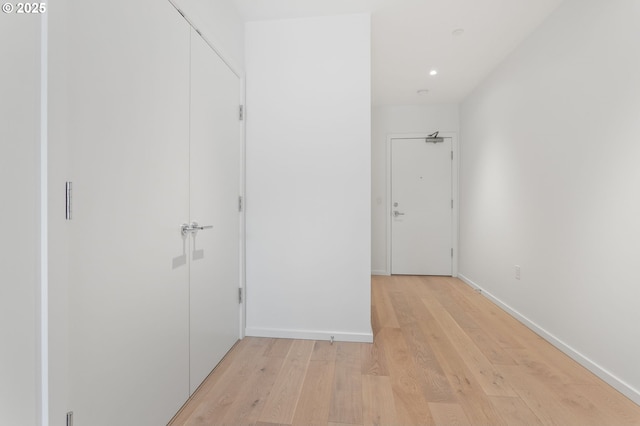 1150 NW Quimby St Unit 608, Portland, OR 97209 - hallway with light wood-type flooring, baseboards, and recessed lighting
